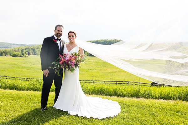 Bride and groom posing for a picture
