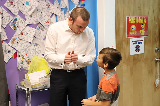 Ryan talking with a young boy