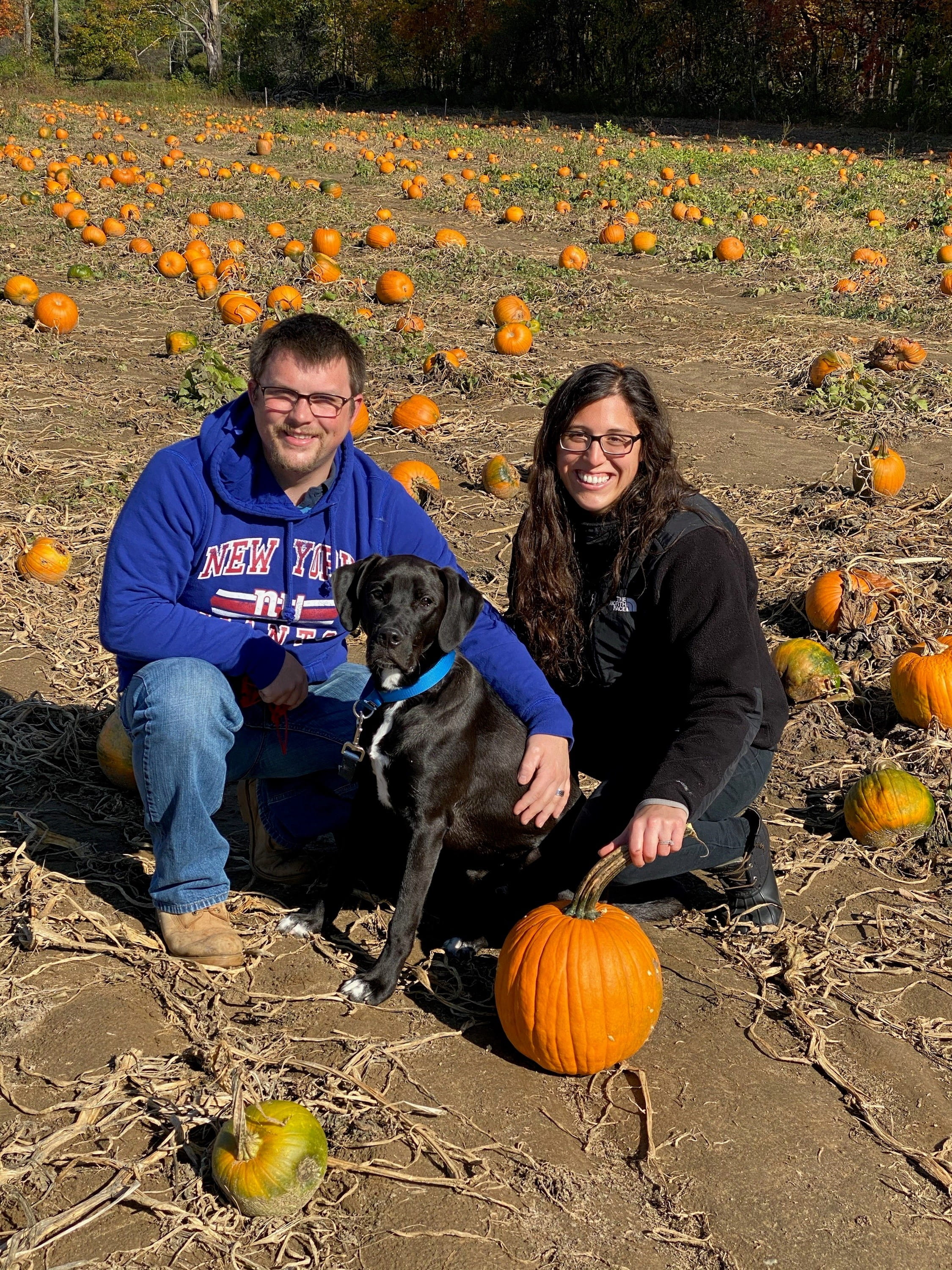 Couple with dog taking a picture